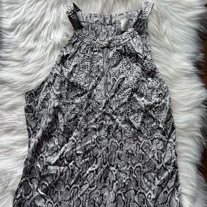 Sexy Snake skin top with Silver Embezzlement on the front.